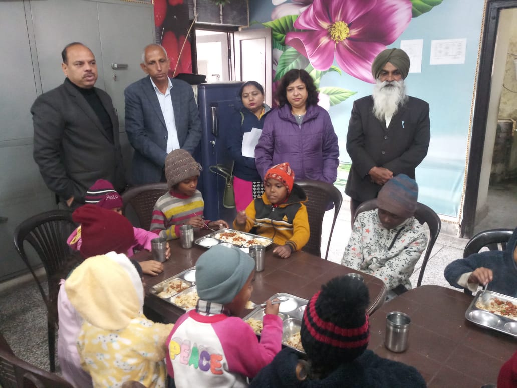 Children in a group activity at the shelter home